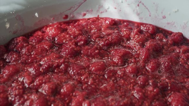 Close up shot of a fresh raspberry jam or confiture. 