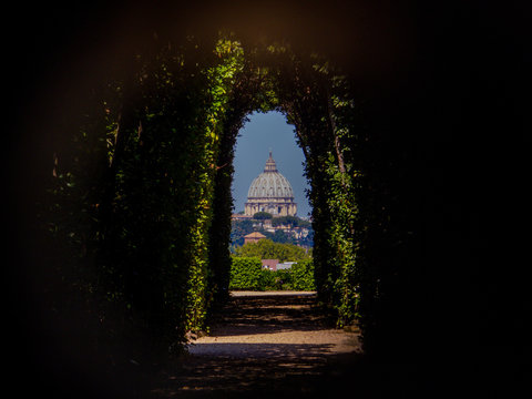 St. Peter's Basilica as seen from the Keyhole on the door of the Villa del Priorato di Malta (or Magistral Villa). In Rome, Italy