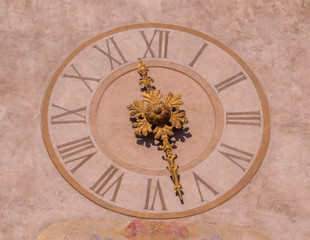 Fototapeta na wymiar The clock on the Clock Tower (Italian: Torre dell'Orologio) in Bergamo, Italy