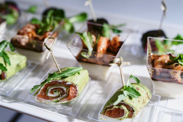 Tray of snacks at a banquet or reception. Catering buffet at party. Buffet table welcome drink concept
