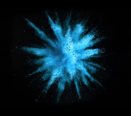 Explosion of colored powder on black background