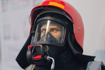 Modern fireman helmet and protective clothing on a mannequin