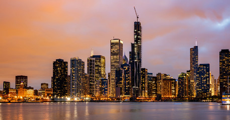 Panoramic view of Chicago city high rise buildings cloudy sky in the evening