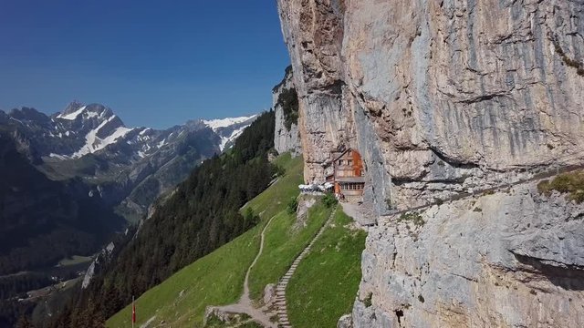 Flight around chalet in the rock on Ebenalp, Canton of Appenzell, Switzerland