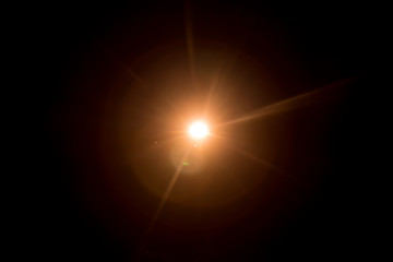 Abstract Natural Sun flare on the black background.