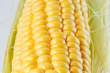 Close-up photo of yellow corn background, healthy and tasty food.