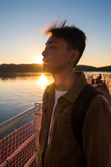 Portrait of young man in deep thoughts and contemplation.