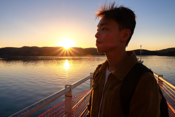 Portrait of young man in deep thoughts and contemplation.