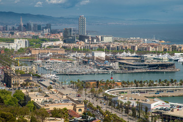 Naklejka premium Barcelona, Spain - April, 2019: Barcelona and port Port Vell from natural park Montjuic, Spain
