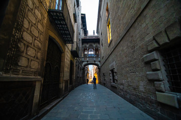Fototapeta premium Barcelona, Spain - April, 2019: Old streets of the Gothic Quarter of Barcelona, Catalonia is centre of old city of Barcelona. Center of touristic life