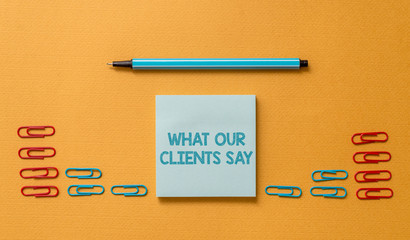 Handwriting text What Our Clients Say. Conceptual photo testimonials or feedback of aclient about the product Colored blank sticky note clips binders gathered pen trendy cool background