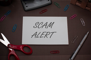 Handwriting text writing Scam Alert. Conceptual photo unsolicited email that claims the prospect of...