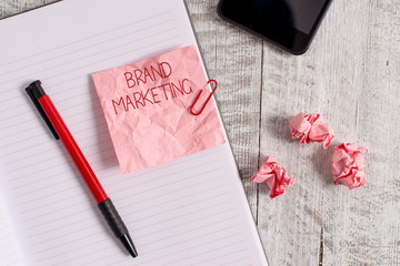 Writing note showing Brand Marketing. Business concept for Creating awareness about products around...