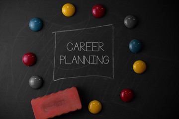 Text sign showing Career Planning. Business photo text A list of goals and the actions you can take to achieve them Round Flat shape stones with one eraser stick to old chalk black board