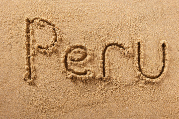 Peru word written in sand sign writing drawing drawn on a sunny summer beach holiday vacation travel destination message photo