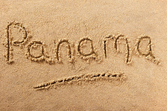 Panama word written in sand sign writing drawing drawn on a sunny summer beach holiday vacation travel destination message photo