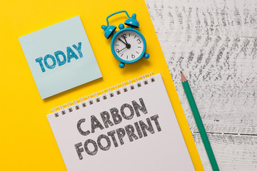 Text sign showing Carbon Footprint. Business photo showcasing amount of dioxide released atmosphere...