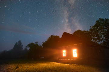 Fototapeta na wymiar Old house under stars