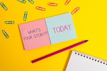 Handwriting text What S Is Your Story question. Conceptual photo analysisner of asking demonstrating about past life events Colored square blank sticky spiral notepads pencil clips color background