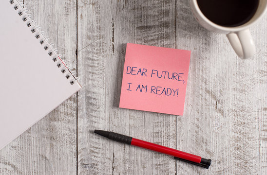 Handwriting text Dear Future I Am Ready. Conceptual photo Confident to move ahead or to face the future Stationary placed next to a cup of black coffee above the wooden table