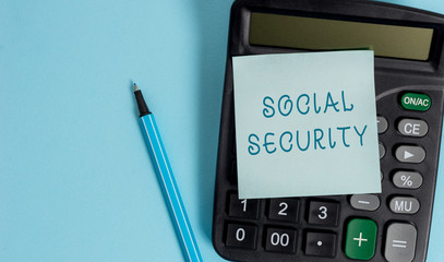 Conceptual hand writing showing Social Security. Concept meaning assistance from state showing with inadequate or no income Electronic calculator sticky note marker colored background