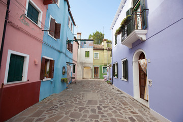 street in Burano island italy which is known for its bright and colourful houses