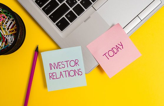 Text sign showing Investor Relations. Business photo text analysisagement responsibility that integrates finance Trendy metallic laptop sticky notes clips container pencil colored background