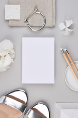 flatlay paper invitation mockup minimalistic white hydrangea light grey romantic clean