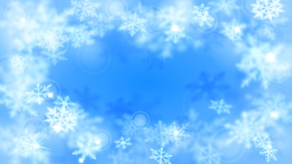 Christmas blurred background with frame of complex defocused big and small snowflakes in light blue colors with bokeh effect