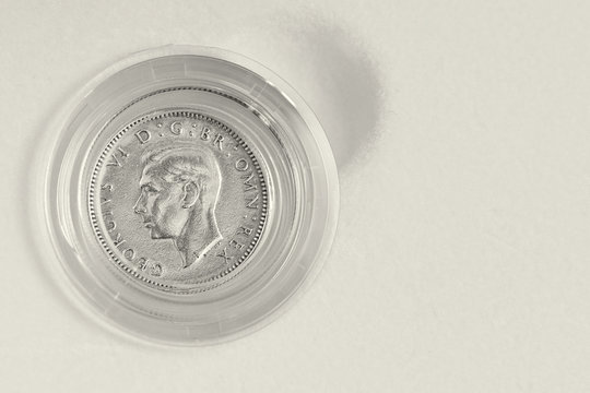 Lucky silver sixpence for wedding on white background