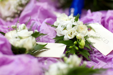 wedding button hole of flowers with note