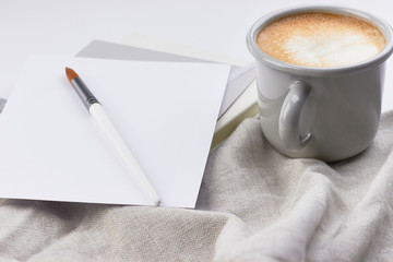 watercolor paper brush cup coffee working flatlay artist minimalistic light grey