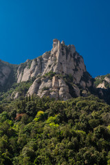 Montserrat, Spain - April, 2019: Santa Maria de Montserrat Abbey in Monistrol de Montserrat, Catalonia, Spain. Famous for the Virgin of Montserrat.