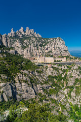 MONSERRAT, SPAIN - April, 2019: Top view of Santa Maria de Montserrat Abbey in Monistrol de...