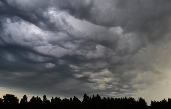 Asperitas clouds - the newest cloud type - before the storm in belarussian village.