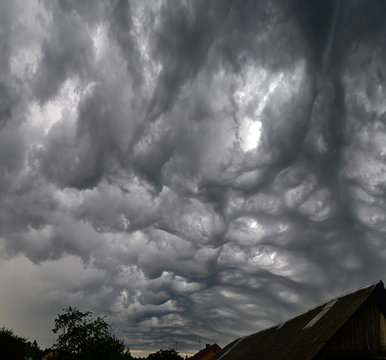 Asperitas clouds - the newest cloud type - before the storm in belarussian village.