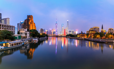 Shanghai city skyline and water reflection,China