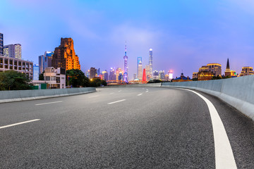 Shanghai skyline and asphalt road scenery at night,China