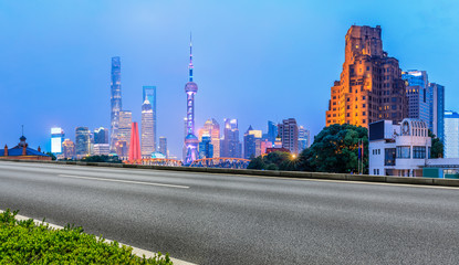 Fototapeta na wymiar Shanghai skyline and asphalt road scenery at night,China