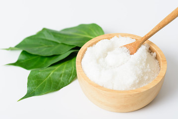 Gymnema inodorum leaf and sugar on white background, medicine herbal plant for diabetes treatment, function is control sugar level in blood