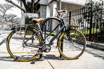 Fototapeta na wymiar black bicycle attached to a bike rack