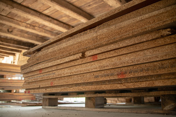 Taking photographs of wood plywood, used for making pellets