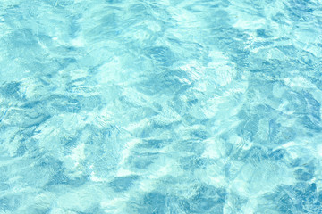 Close-up view of a transparent turquoise sea water that forms a natural texture, Emerald Coast, Sardinia, Italy.