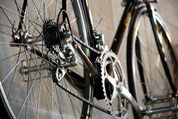 closeup of the gears and chains of a bicycle