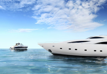 a luxury private motor yacht on tropical sea surface with blue sky clouds sunshine, empty...