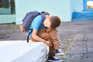 schoolboy is depressed. back to school. the first autumn day. the child is not in school. apathy no friends in the new school.problem communication with their peers.