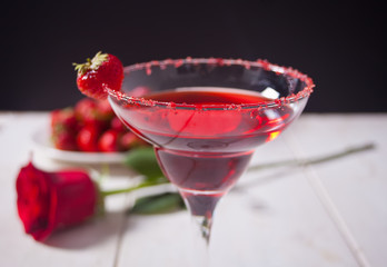 Red exotic alcoholic cocktail in clear glass