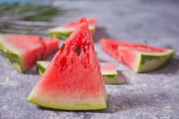 Fresh ripe sliced watermelon on gray background