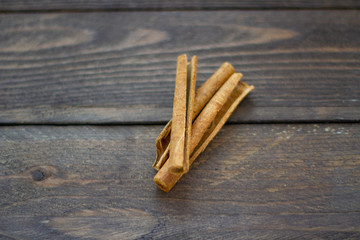 cinnamon sticks on wooden table
