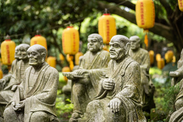 Fototapeta premium groups of buddhist arhat stone statue